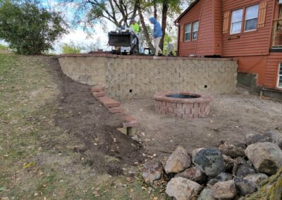retaining wall, hardscaping, and fire pit | during
