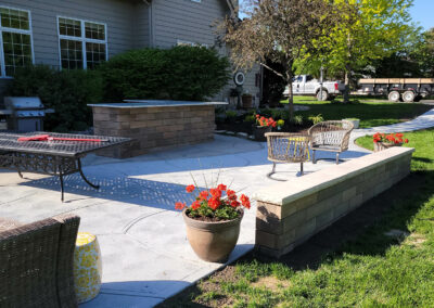 concrete patio with retaining wall