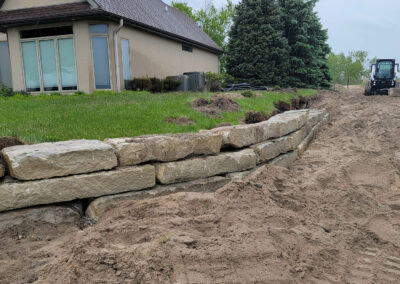 boulder retaining wall | during