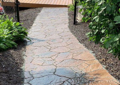 flagstone walkway leading to pool | after