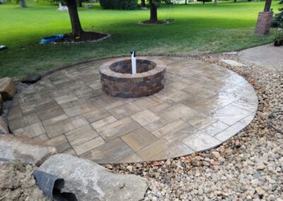 circular paver patio with fire pit